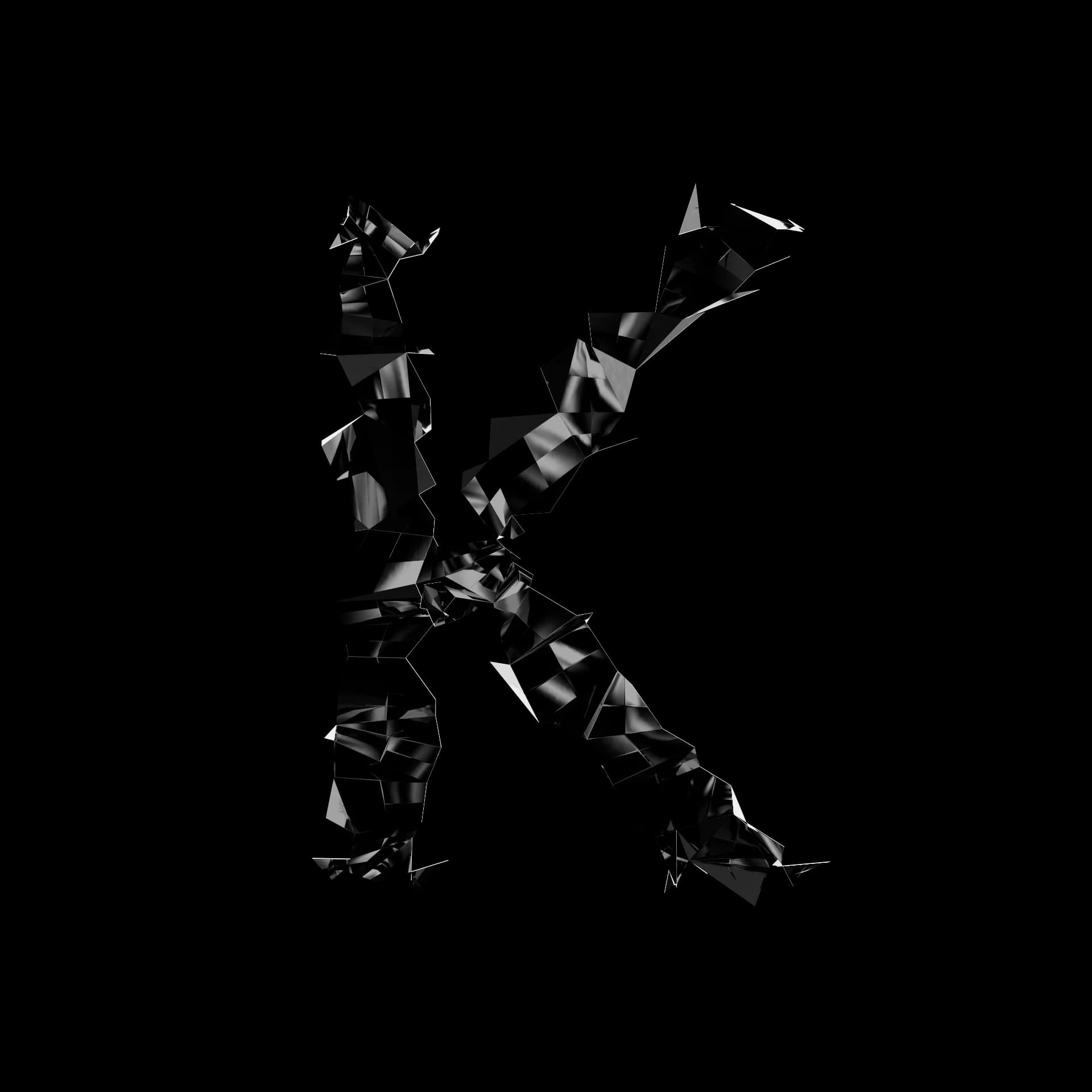 Letter K from Shard Type: a 3D character shattered into angular shards of black specular material on a white background